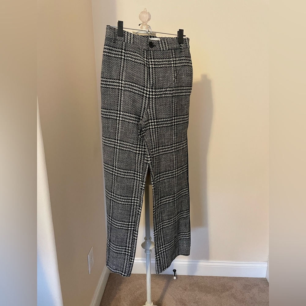 Anthropologie cotton/polyester track pants with side stripes.